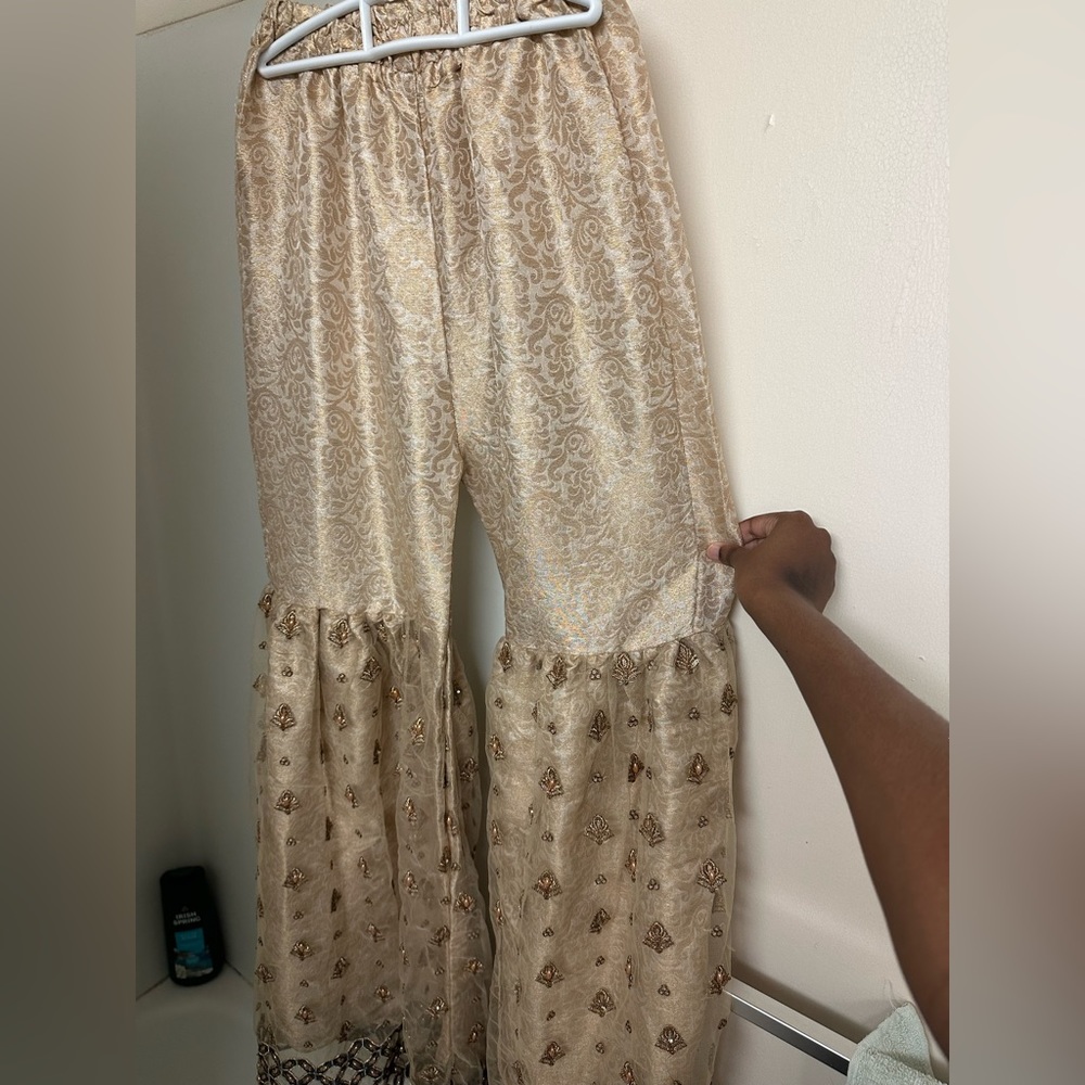 Brand New, made in Pakistan. The embroidery is handmade and stitched on.
